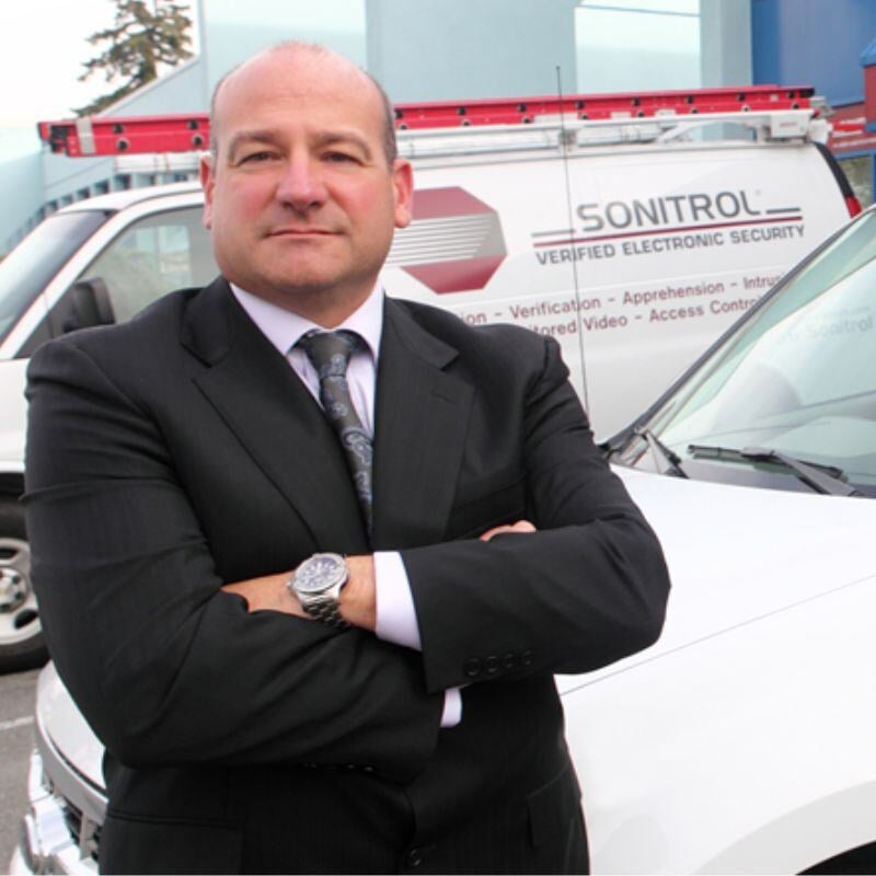Joe Wilson in front of Sonitrol Van