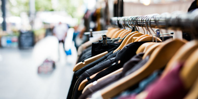 Clothes hanging up in a retail shop