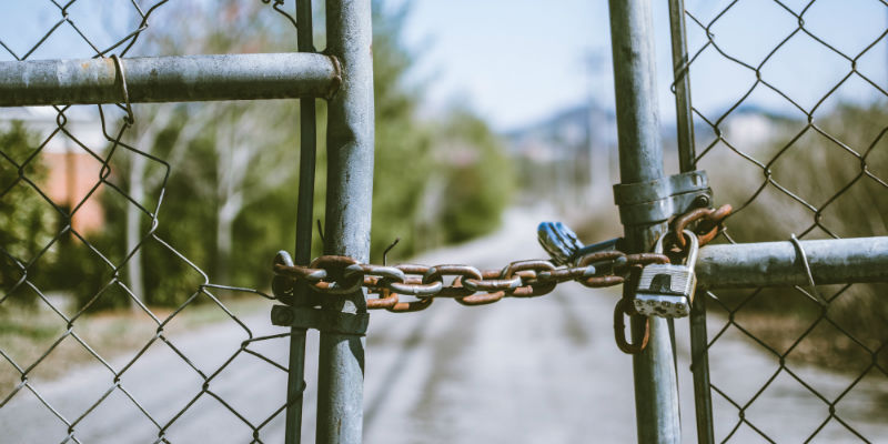 Business fence with rusty padlocks